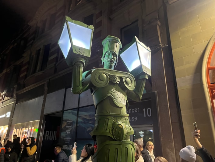 Light Night 2025: On Briggate, ten feet tall Living Lamp Posts strode among amazed onlookers.