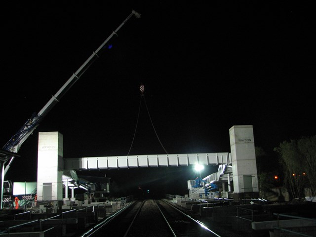 Buckshaw Parkway: The night-time scene as the overbridge is gently lowered into position.