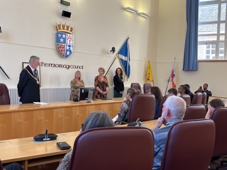 Moray Council Civic Leader, Cllr John Cowe, addresses the assembled audience during a citizenship ceremony held in Moray Council HQ Chambers on 19 September 2024.