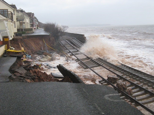 Damage to the railway at Dawlish in Devon: Severe damage to the sea defences and railway at Dawlish in Devon caused by major storms
