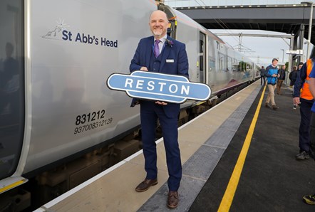 Matthew Golton, Managing Director of TransPennine Express with the newly named 'St Abb's Head' train, the first passenger service to stop at Reston Station in more than 50 years.