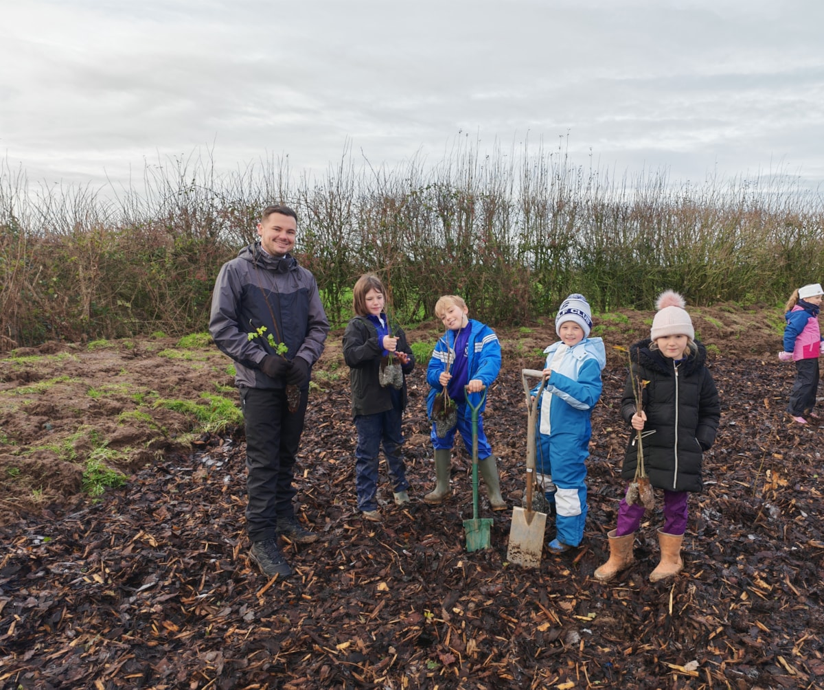Councillor Joshua Roberts tree planting with youngsters in Treales