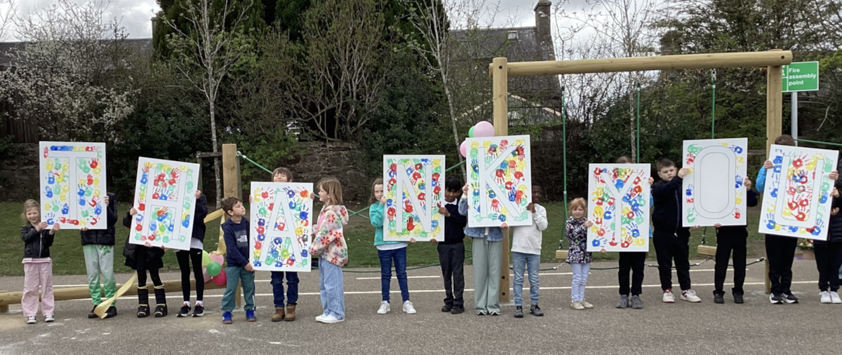 Keith Primary pupils sharing a creative thank you message at playground opening event