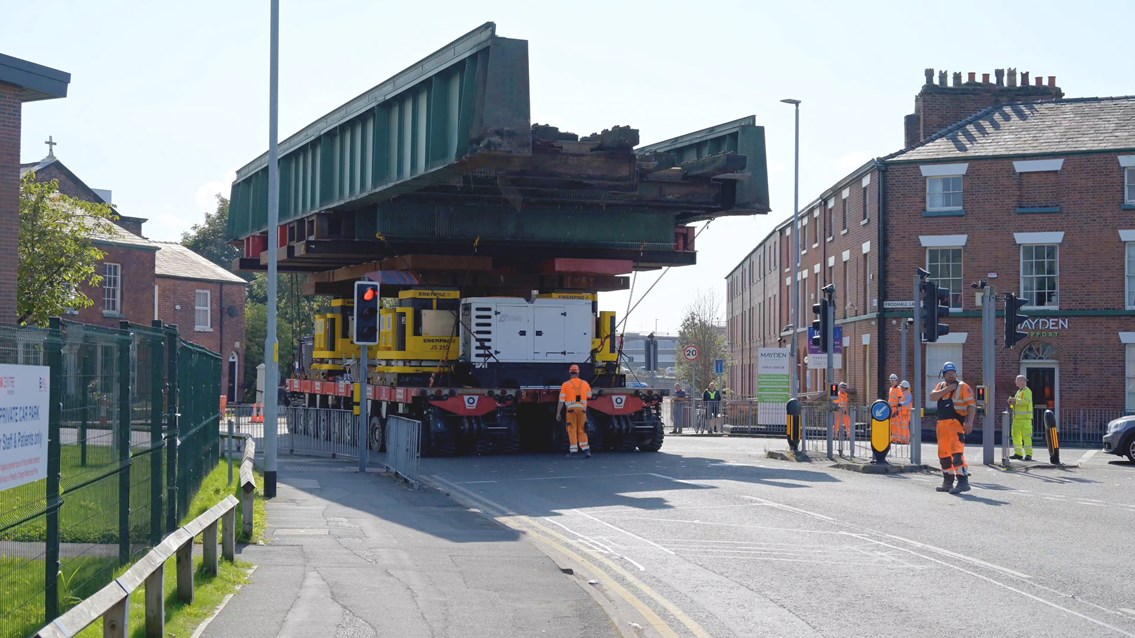 Abnormal load - video shows railway bridges driving through town centre: Warrington railway bridge being driven down street in August 2021 during similar upgrade to Leamington Spa Easter 2022 work
