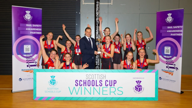 21040756 cropped: GLASGOW, SCOTLAND - APRIL 19: Ross Moran presents the winner's trophy as Network Rail announce a three-year partnership with Netball Scotland at the Emirates Arena, on April 19, 2024, in Glasgow, Scotland.