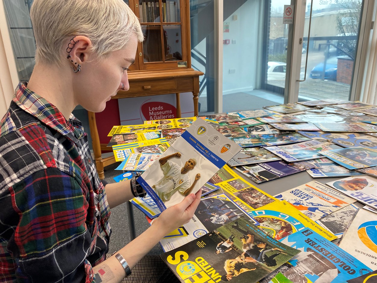 LUFC programme donation: Amy Thraves-Connor has been working on a placement with Leeds Museums and Galleries, scouring through boxes of the donated programmes, searching for those which help tell both the story of the club and how the team has influenced life in Leeds both on and off the pitch.