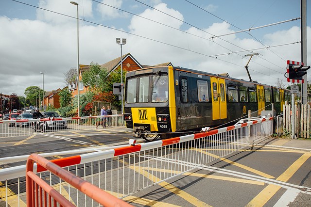Back in service: How Network Rail completely rebuilt a power substation in Sunderland: Metro train at level crossing - Image provided by Nexus