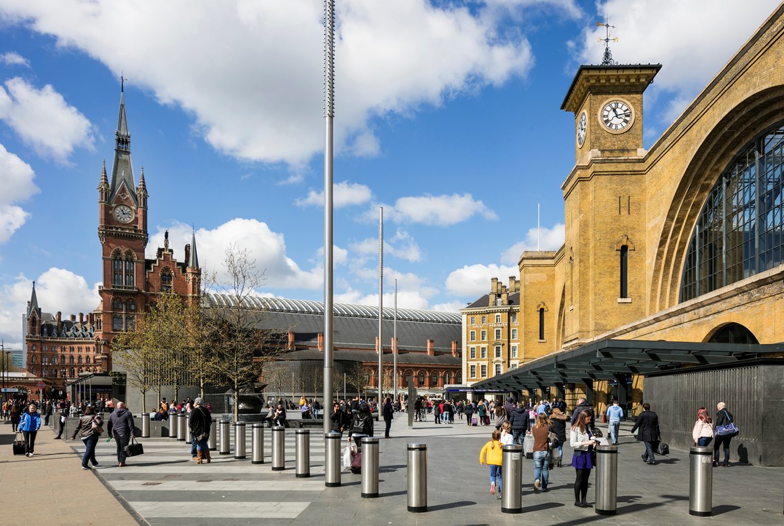 King's Cross railway station - St. Pancras Renaissance Hotel in background: King's cross railway station
clock tower
king's square
train station
busy
people
crowds
day