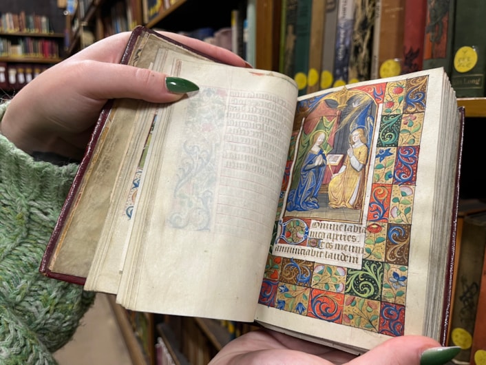 The Book of Hours: Library and digital assistant Alex Brummitt with The Book of Hours at Leeds Central Library.
Penned in around 1480 and inscribed on delicate vellum, the Horae beatae Mariae Virginis, or Book of Hours, contains forty-six vividly illuminated images depicting various duties to be carried out each month along with the signs of the zodiac.