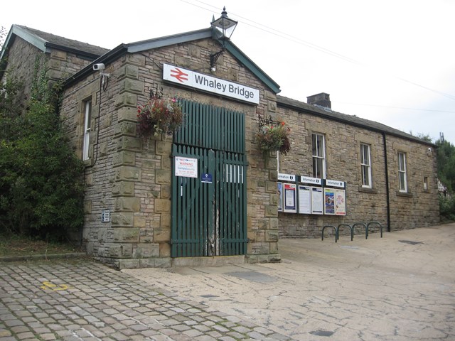 Whaley Bridge station exterior: Photo showing the wooden slatted station entrance doors that will be replaced with oak panel doors.