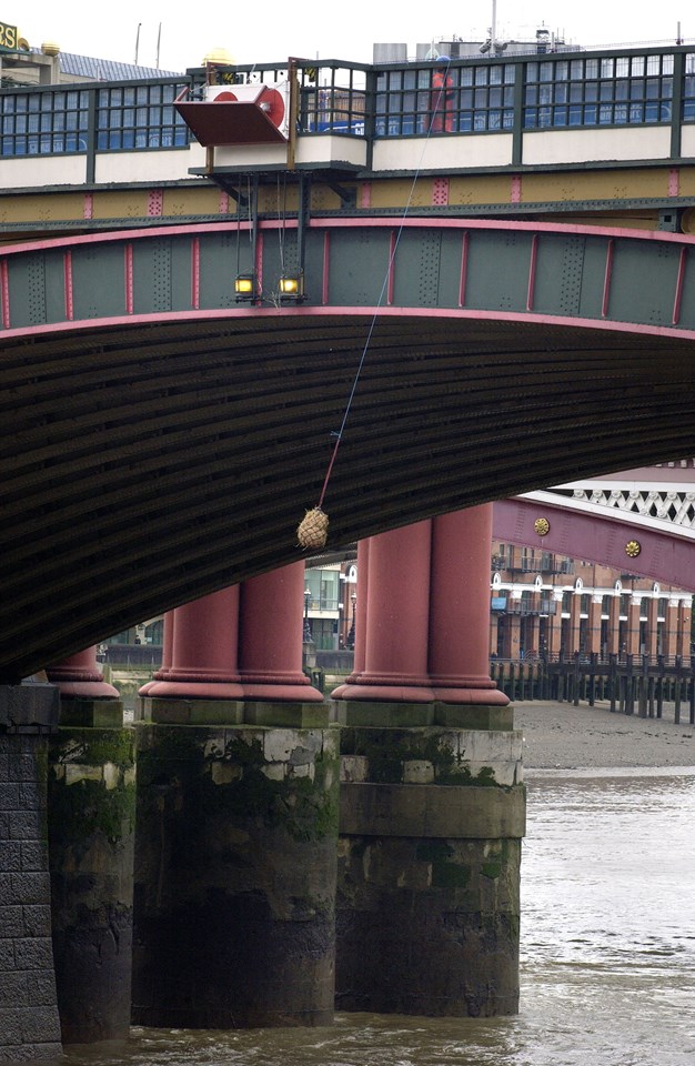Blackfriars Bundle of Straw: A traditional ceremony: A bundle of straw was hung from the underside of Blackfriars rail bridge to warn river traffic that work is taking place overhead (part of the Thameslink Programme)