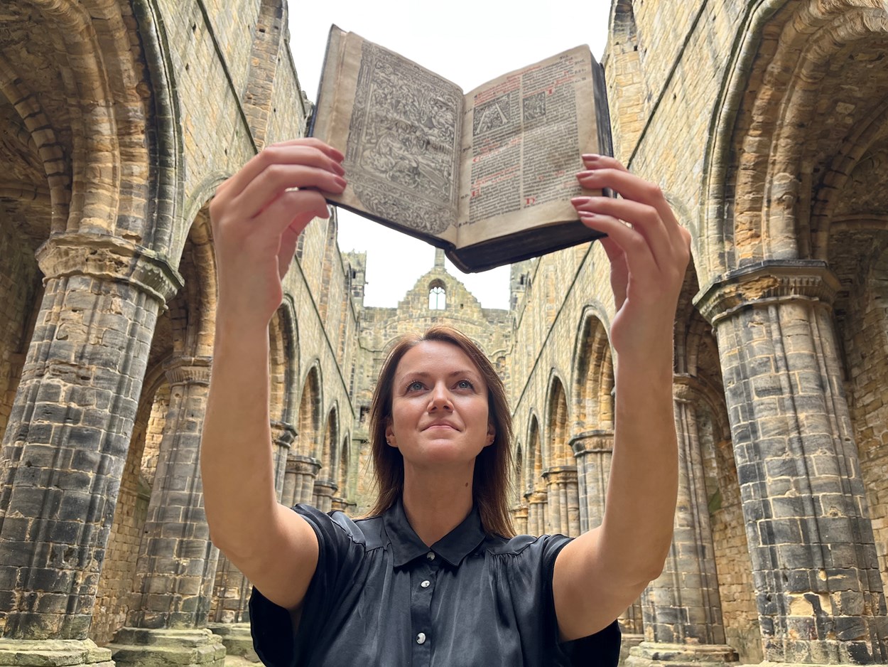 Kirkstall Missal: Senior librarian Rhian Isaac in Kirkstall Abbey with Leeds Central Library's precious copy of the Missale ad usum Cistercienci. Printed in Paris in 1516, the book is believed to have once belonged to the monks of Kirkstall Abbey and remarkably, it still contains notes and passages they delicately wrote by hand.