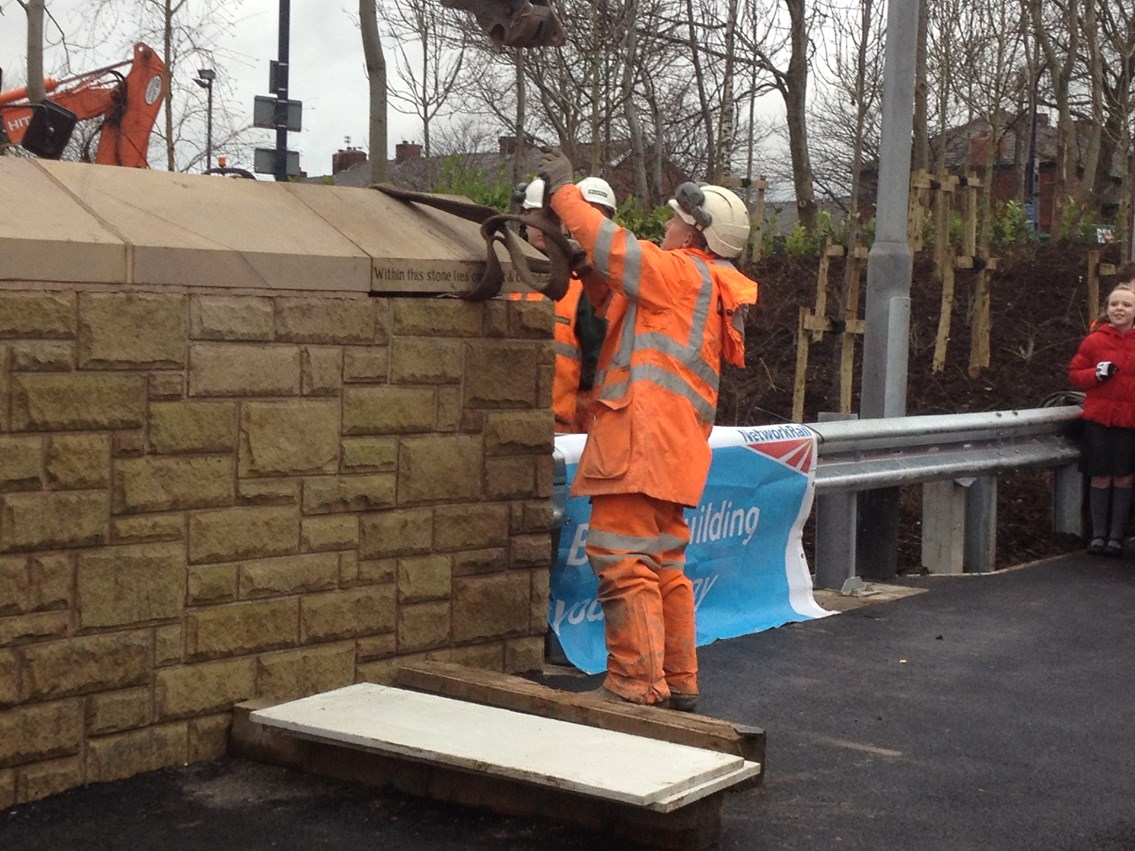 The final stone on the Henrietta Street bridge is put into place