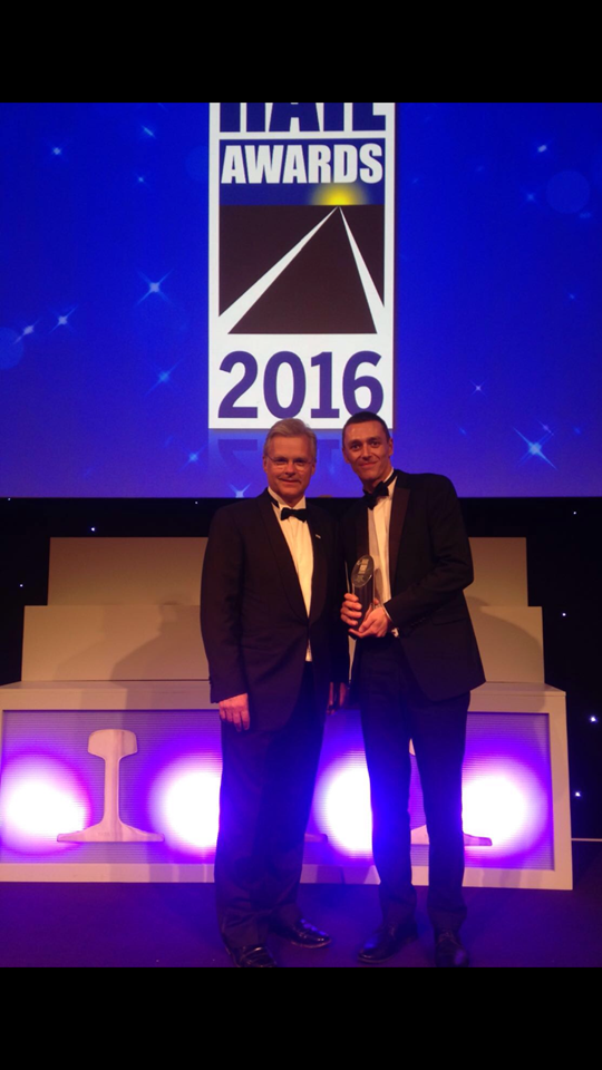 Mark Carne and Tom Crosby, National Rail awards 2016: Tom Crosby (right) accepting his Judges Special Award from Network Rail's chief executive Mark Carne (left), at the National Rail Awards