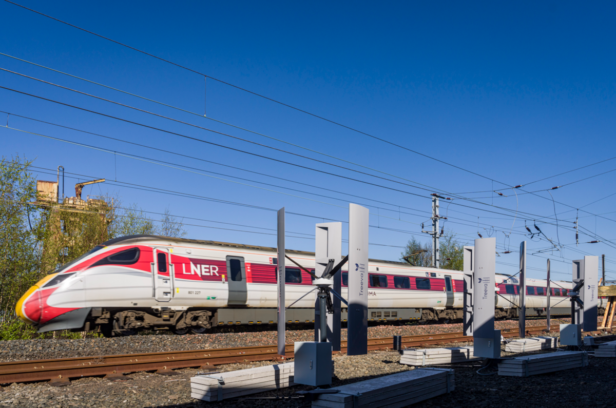 Treeva tubines trackside as LNER Azuma passes
