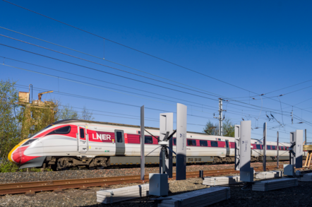 Treeva tubines trackside as LNER Azuma passes