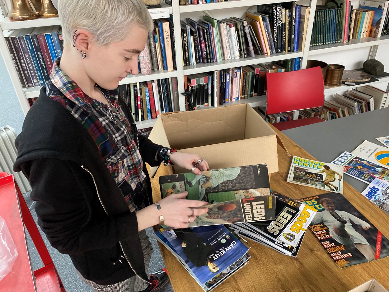 LUFC programme donation: Amy Thraves-Connor has been working on a placement with Leeds Museums and Galleries, scouring through boxes of the donated programmes, searching for those which help tell both the story of the club and how the team has influenced life in Leeds both on and off the pitch.