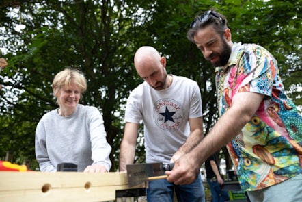 Cllr Champion and Cllr Potts making a bee hotel