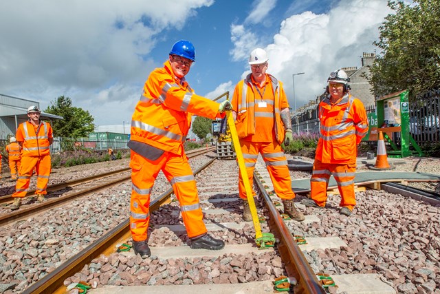 Aberdeen track 1 - Alex Hynes helping clip final section of rail into place