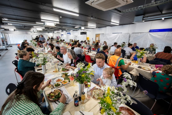 Community lunch at OOC using dinner service made by young people using excavated clay