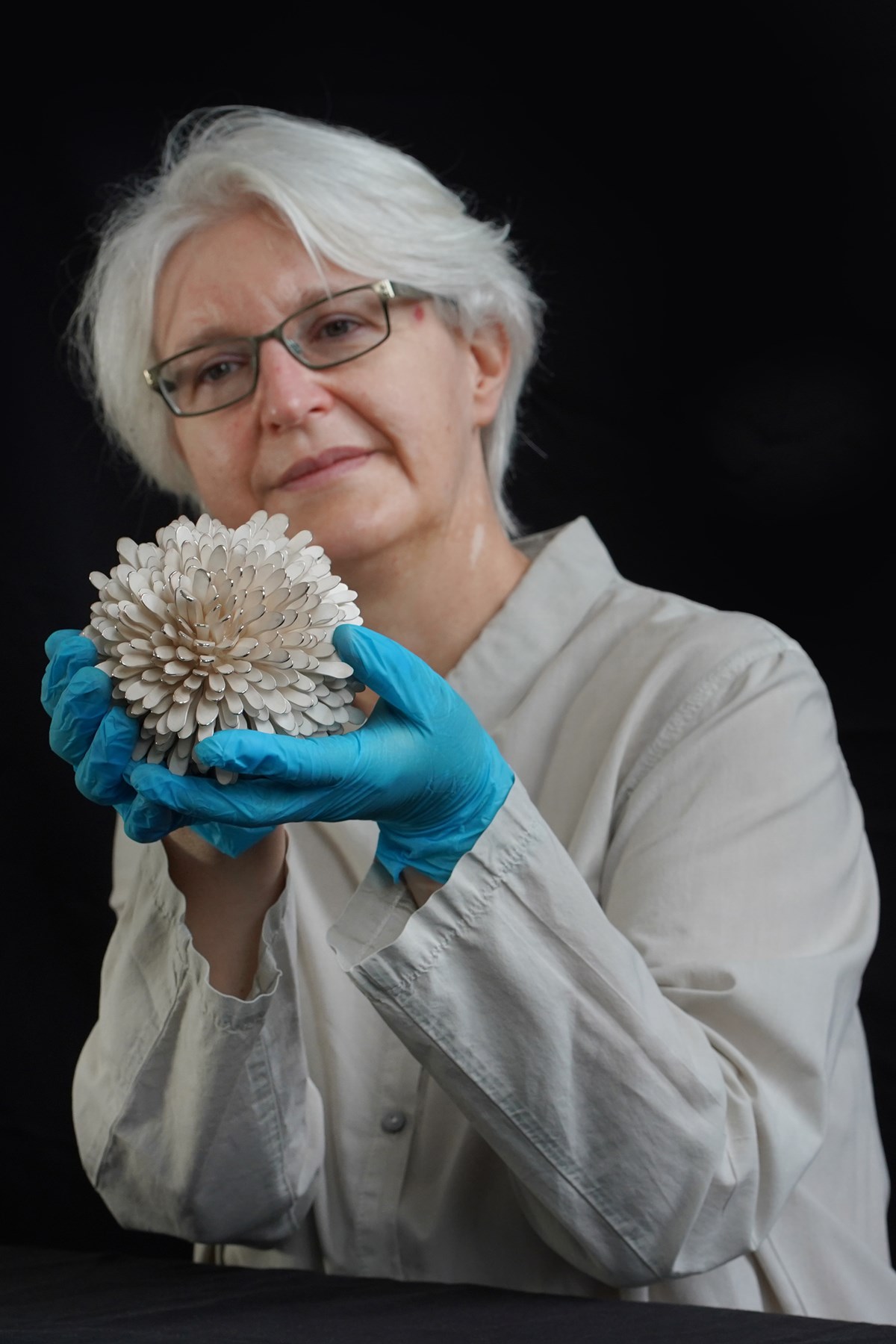Friederike Voigt, Principal Curator National Museums Scotland, with Junko Mori's New Pinecone Silver Organism, 2007. Photo © Stewart Attwood (1)