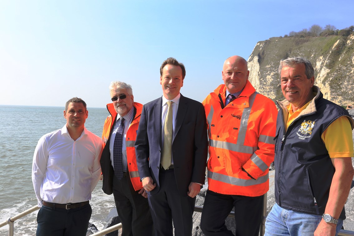 Dover - Shakespeare Beach: Cross-Channel Swimmer Howard James, costain's Charly Clark, MP Charlie Elphicke, Network Rail's Steve Kilby and Channel Swimming Association observer Keith Oiller down on Shakesbeare beach with the cliff behind them