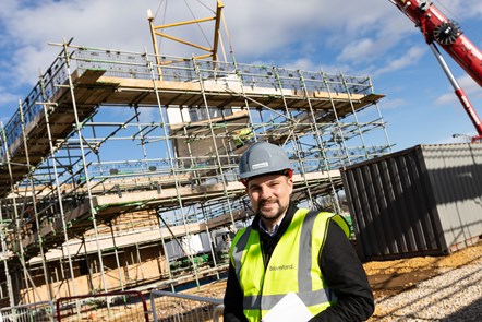 Cllr Joe Harris visiting the Stockwells affordable housing scheme in Moreton-in-Marsh as the homes are craned into place.