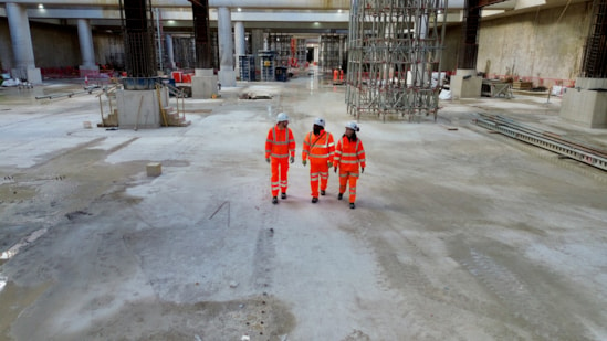 Foundations complete for HS2's Old Oak Common high speed station-3: Workers walk across the competed base slab in the 850m long underground station box at Old Oak Common. 
L-R: Russell D'Urso, HS2 Project Manager, Raj Alagenthirarajah – Expanded Senior Site Engineer,  Kitty Bulmer- BBVS Assistant Package Manager