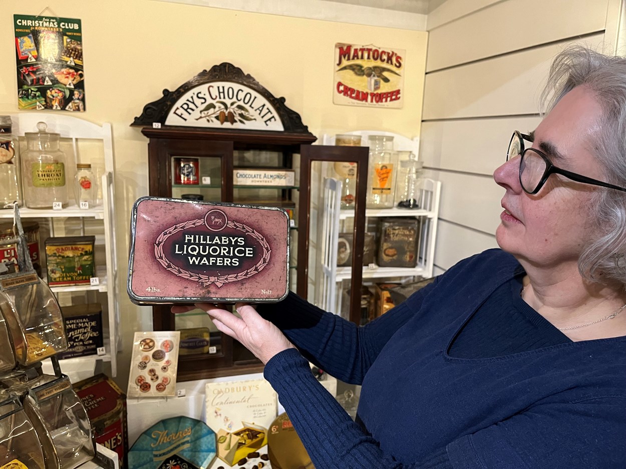 The Power of Persuasion: Kitty Ross, Leeds Museums and Galleries' curator of social history, with some of the vintage confectionery on display as part of The Power of Persuasion at Abbey House Museum.