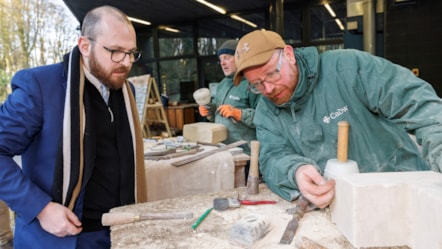 Cadw stonemasons and the Minister
