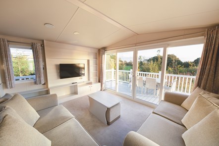 Gold grade caravan - living room & outdoor decking