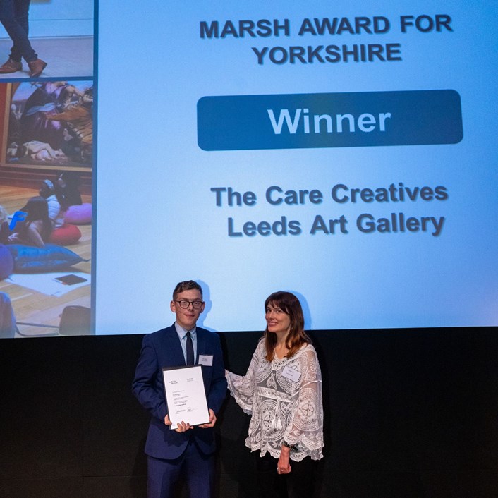 Care Creatives: John Farley and Nicky Lines accepting their award on stage at the event.