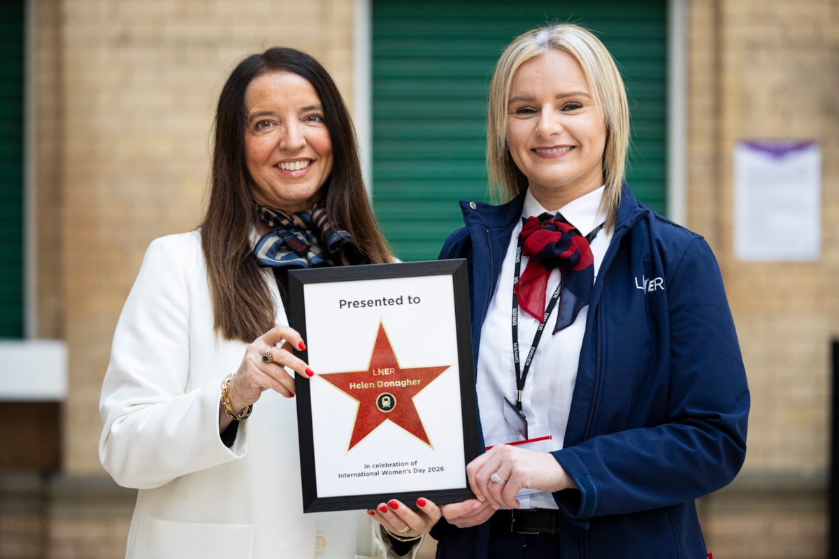 LNER People Director Paula Bullock handing star to lifesaving LNER driver Helen Donagher
