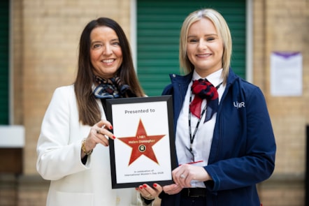 LNER People Director Paula Bullock handing star to lifesaving LNER driver Helen Donagher