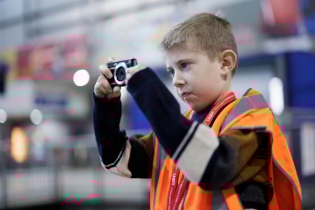 Austin taking a photo of an LNER train at Leeds station, LNER