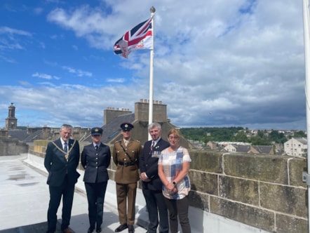 The council’s Service veteran – Cllr Donald Gatt stands with Moray Council Leader Cllr Kathleen Robertson, Moray Council Civic Leader Cllr John Cowe, Fg Off Jessica Hunt of RAF Lossiemouth, and Lt Ethan Knight of 39 Engineer Regiment to raise the Armed Forces Day flag this morning (28 June) ahead of