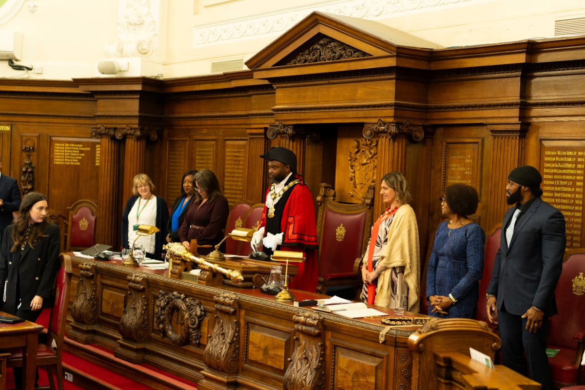 Mayor of Islington, Cllr Jason Jackson standing in the Council Chamber