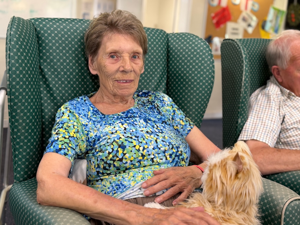 Olive Wells with a robotic cat