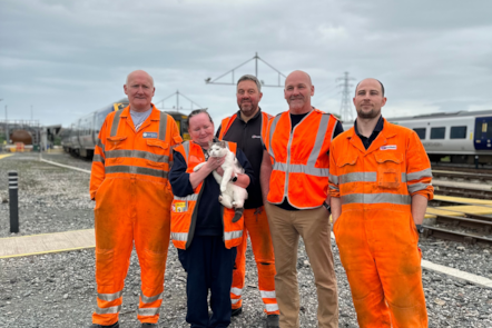 An image of 'The Cat' with members of staff at Northern's TrainCare Centre in Barrow