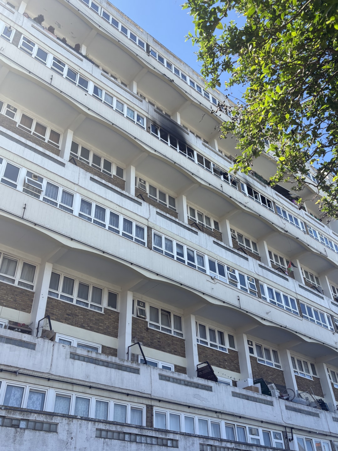 A photo of the exterior of Sara Lane Court showing the flat affected by the fire on 24 April 2026