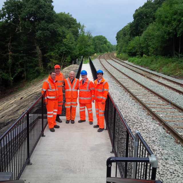 Local politicians inspect landslip repairs on railway between Buxton and Manchester: Cllr Harold Davenport(2nd from right) and David Rutley MP(right) with staff from Network Rail inspecting the site of June's landslip between Buxton and Manchester