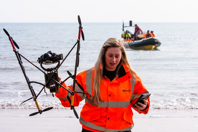 UAV survey team (Resource Group): Unmanned Aerial Vehicle (UAV) being launched from a Rigid Inflatable Boat (RIB) at Teignmouth as part of a geological survey to improve the resilience of the railway between Exeter and Newton Abbot