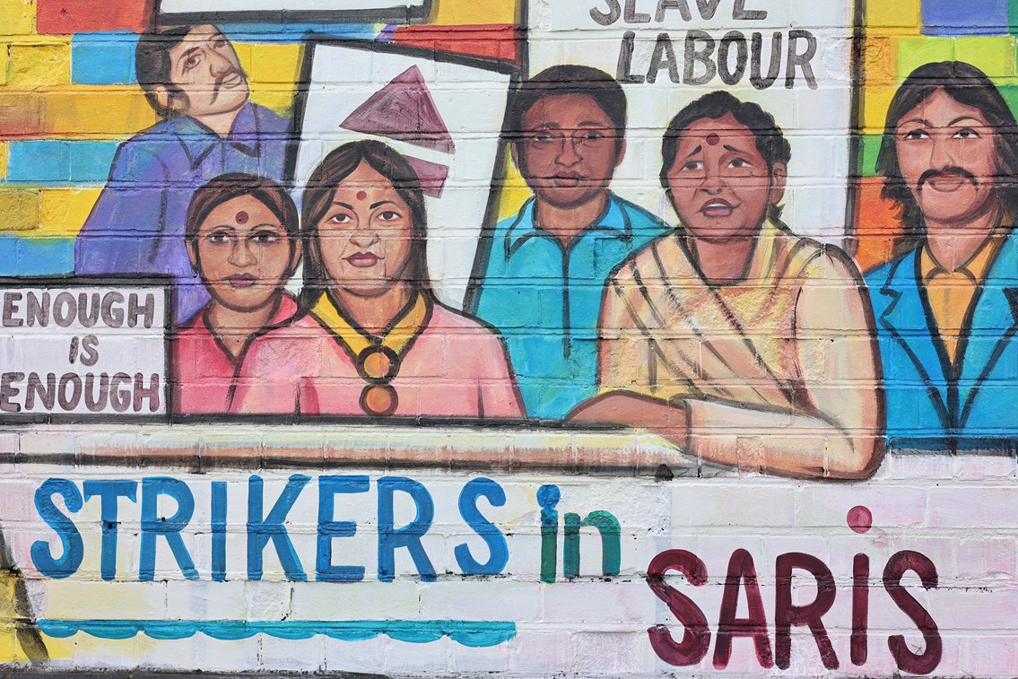 Mural depicting protesting South Asian factory workers in 1970s Birmingham