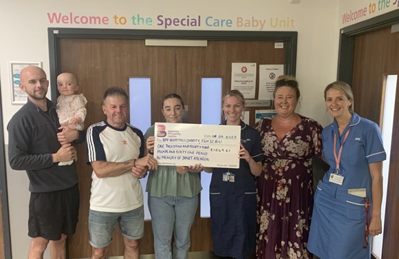 Grateful family donates to Furness General Hospital Special Care Baby Unit in memory of mum & nana: The Atkinson family make their donation to the SBCU - from left, Connor Robinson with Myla, Myles Atkinson, Natasha Atkinson, Ward Manager Helen Wallace, Bay Hospitals Charity Head of Charity and Fundraising Suzanne Lofthouse and Nurse Sarah Houghton