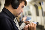 TfL Image - Passenger using phone underground