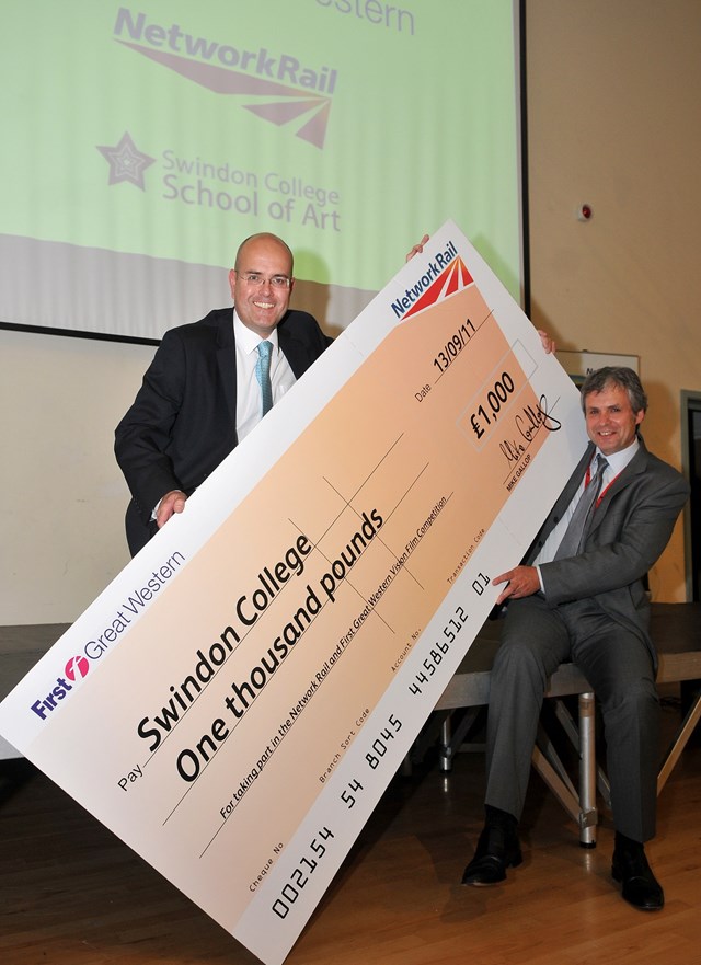 Cheque, please!: Network Rail's Mike Gallop presents a cheque for £1000 to Swindon College principal, Andrew Millar