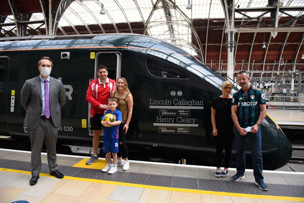 BBC Make A Difference Superstar Lincoln Callaghan, six, has become the youngest to have his name on the side of a train. He is pictured with members of his family including mum Ashleigh and dad Chris, and Wantage MP David Johnston, left