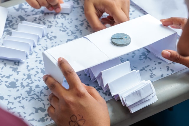 Students building a bridge using paper as one of a number of STEM activities: Students building a bridge using paper as one of a number of STEM activities