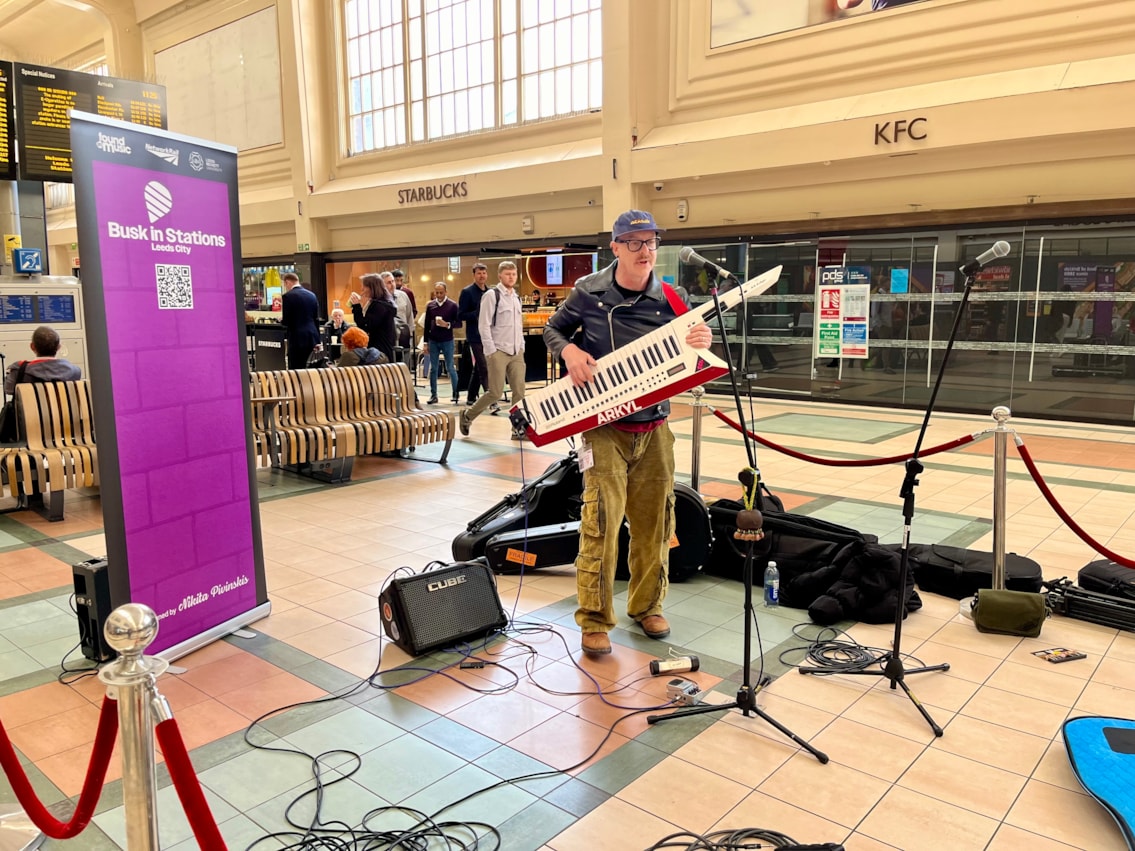 Augustin Bousfield playing at the launch of Busk in Stations at Leeds, Network Rail