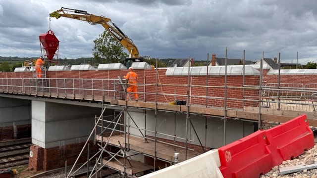Strong progress as new Kirk Hill bridge nears completion: Kirk Hill 3 - installation of the coping stones following successful installation of the new parapets